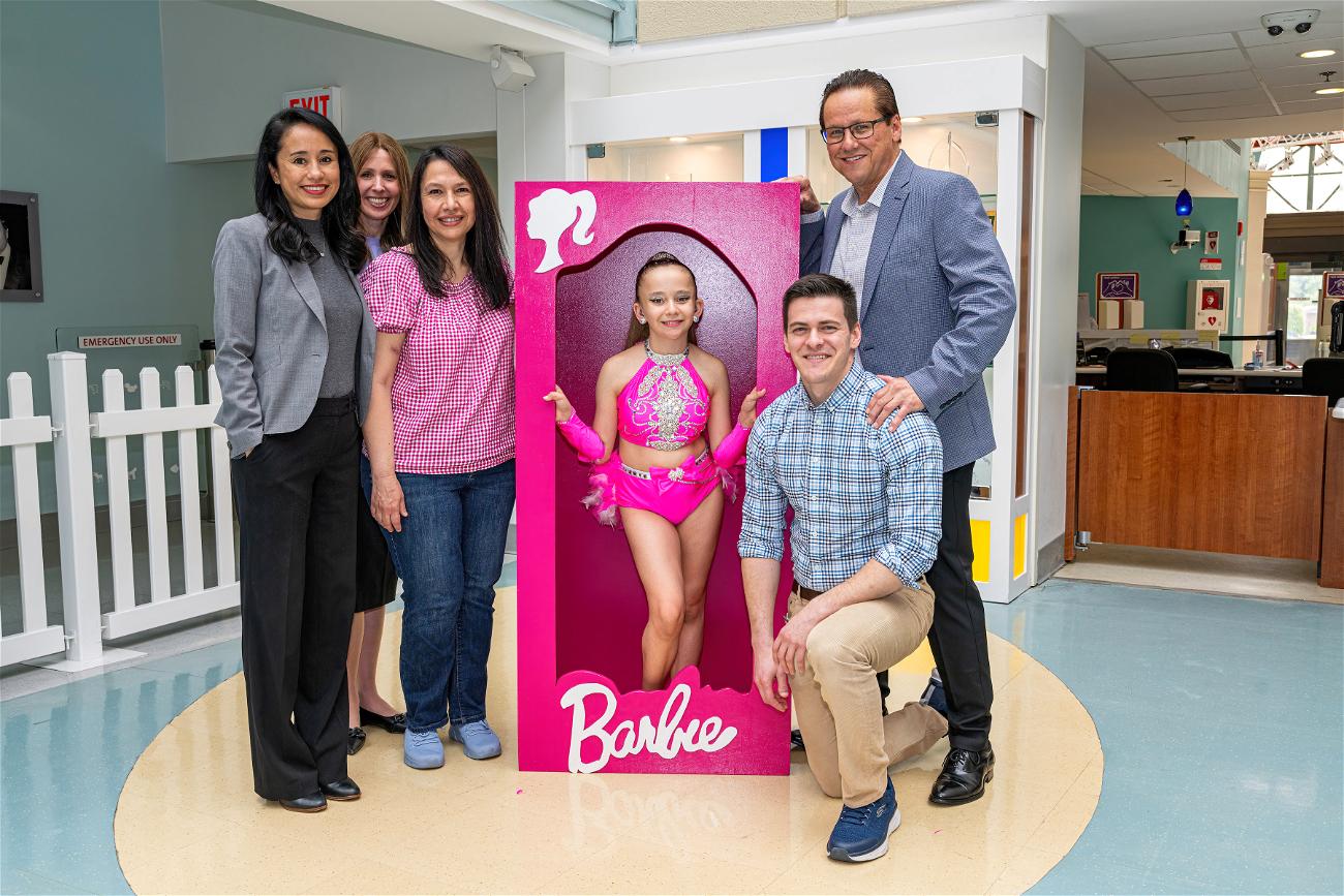 Kidney transplant recipient and 11-year-old Commack resident Emily Alanko with her parents and Cohen Children’s Medical Center doctors. Her older brother (kneeling), a pediatric doctor himself, was Alanko’s kidney donor.