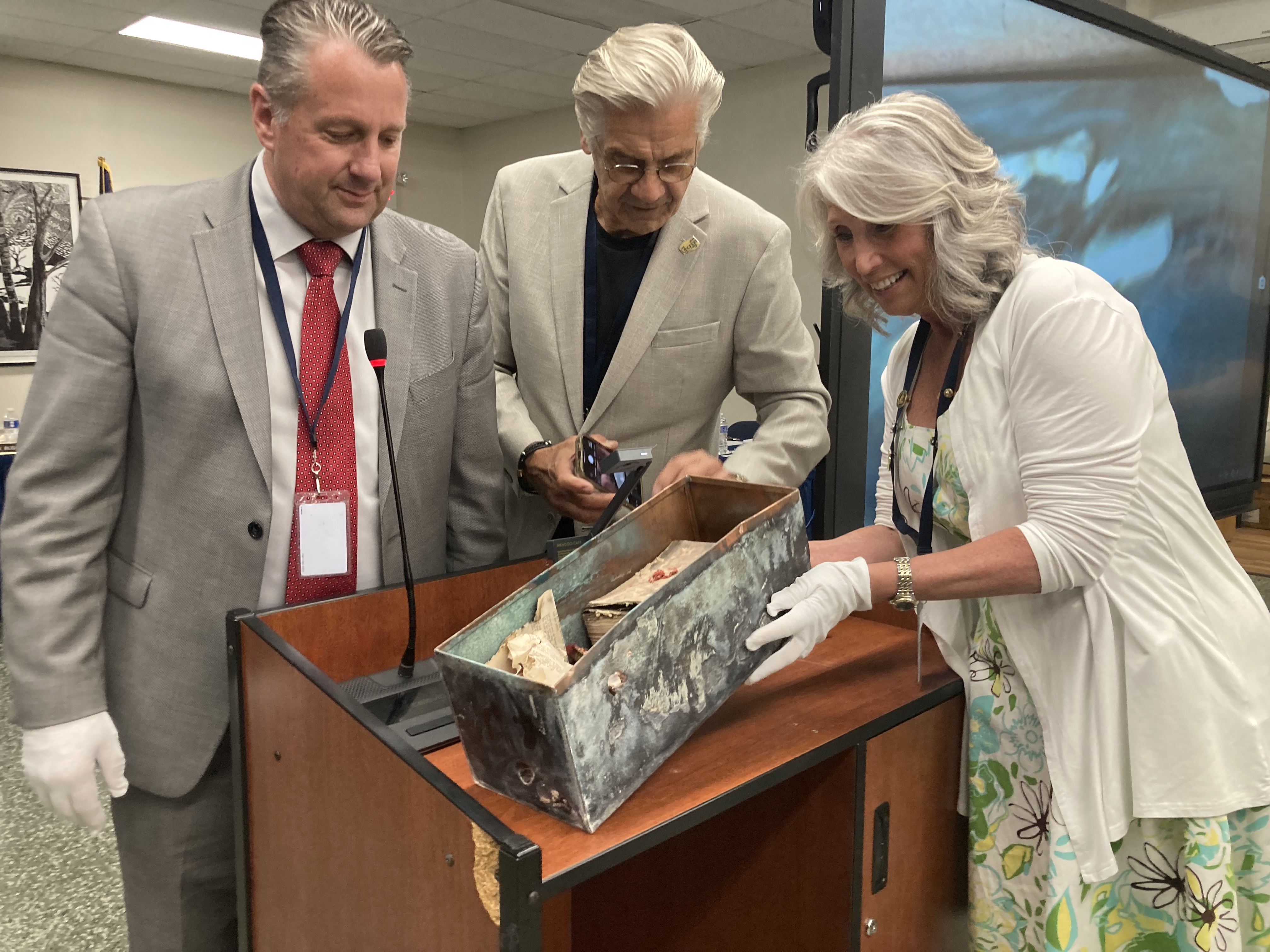 Superintendent of Schools Dave Moyer, BOE President Larry Licopoli and Trustee Carol Taylor at the June 20 celebration in which the contents of a 100-year-old time capsule were revealed. 