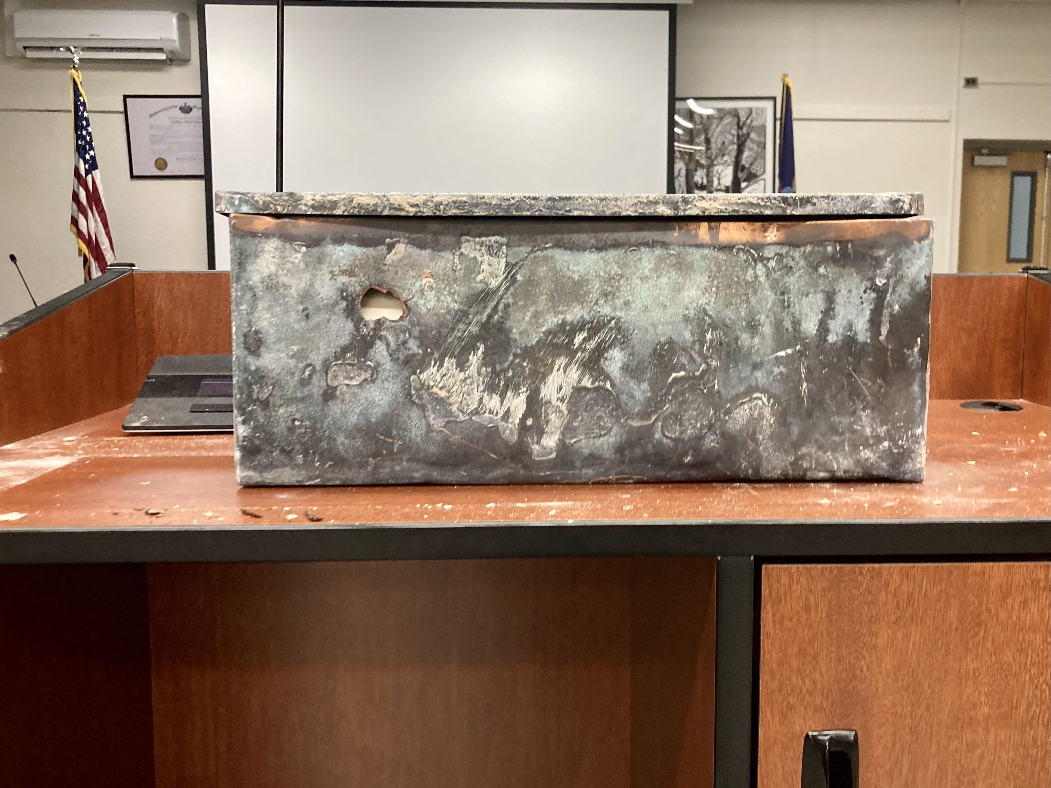 The contents of a 100-year-old time capsule, place within the cornerstone of the William J. Brosnan building in 1924, were revealed at the June 20 BOE meeting.