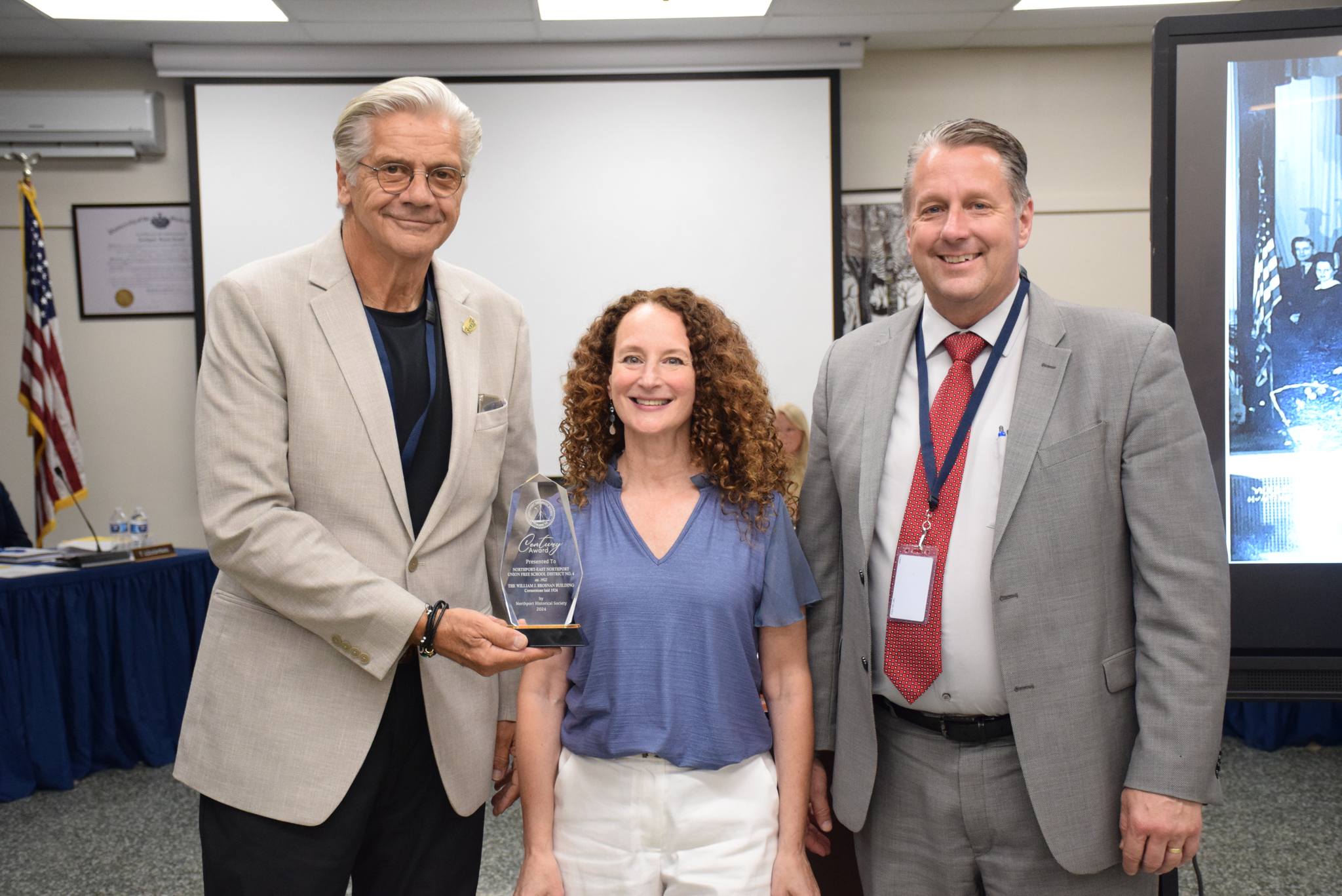NENUFSD Board of Education president Larry Licopoli (left) with Northport Historical Society Executive Director Terry Reid and Superintendent of Schools Dave Moyer.
