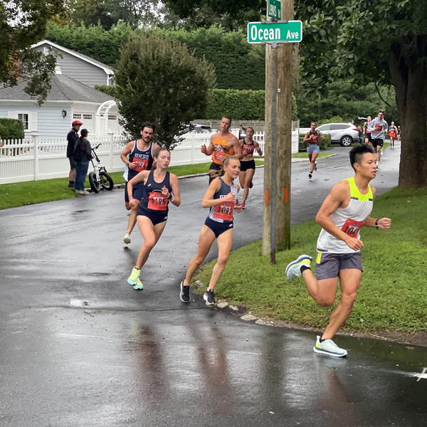 Runners in last year’s Cow Harbor 10K round the corner at Ocean Avenue and Lewis Road. 