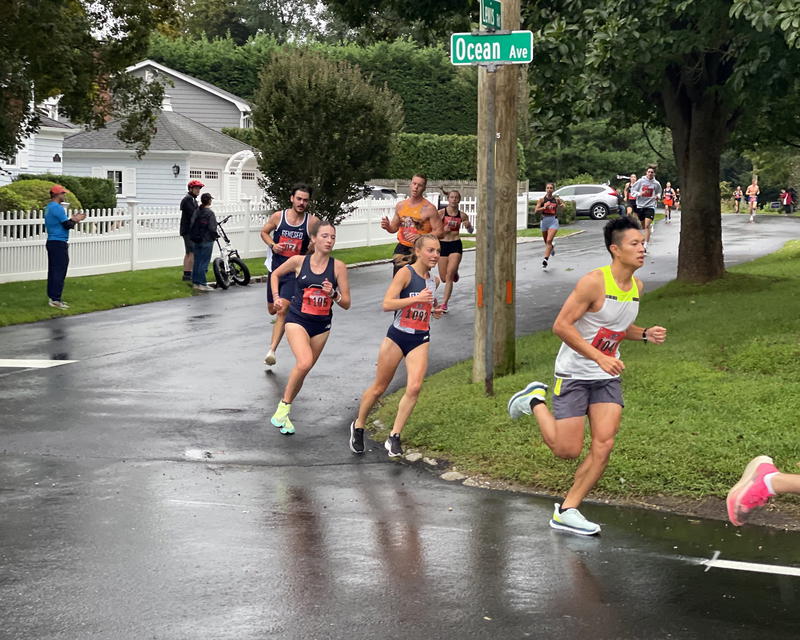 Runners in last year’s Cow Harbor 10K round the corner at Ocean Avenue and Lewis Road. 