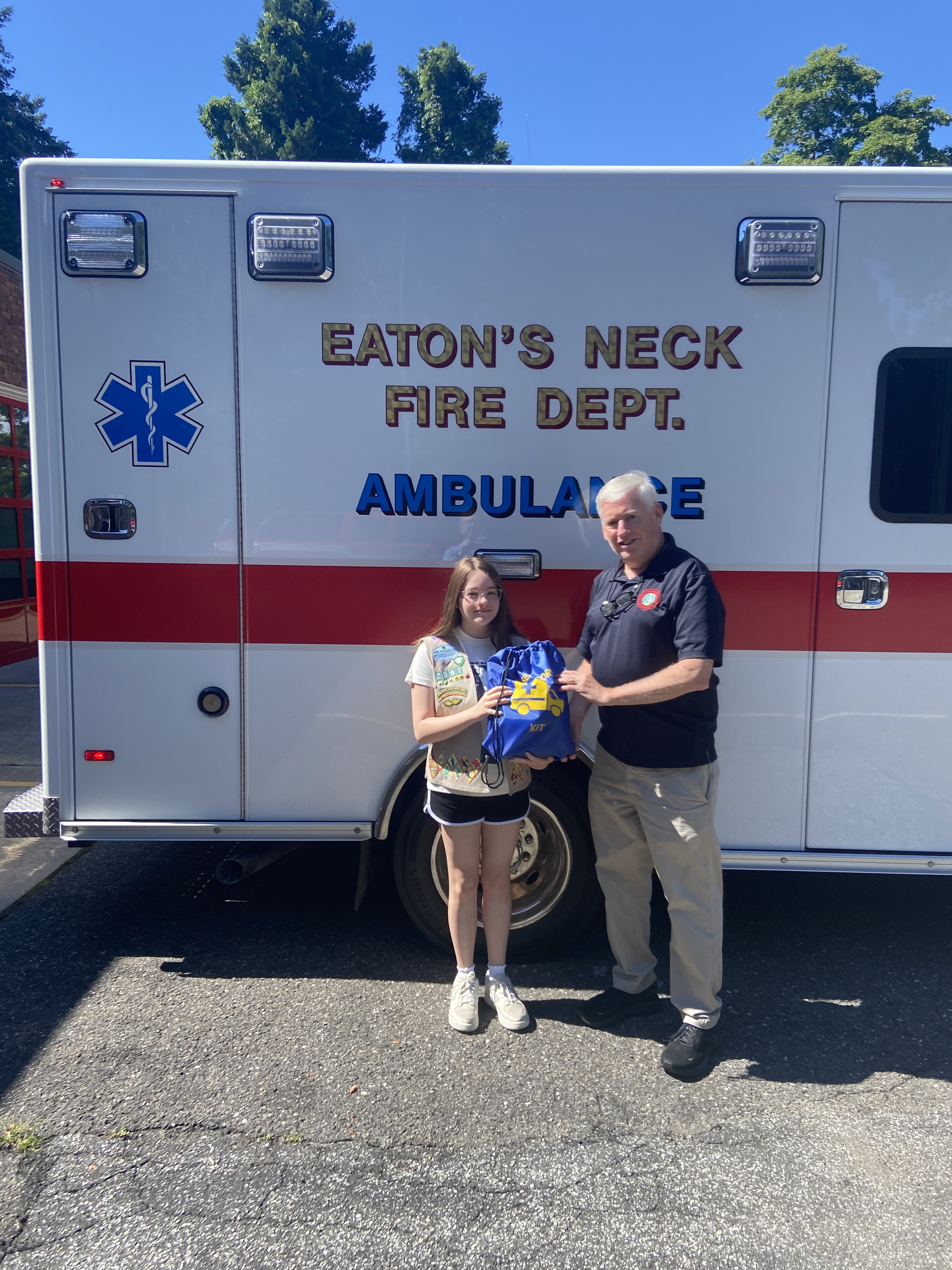 Olivia LoBue presented two sensory kits to Eaton’s Neck Fire Department Captain Andy Reid, to be used on local ambulances to calm residents during stressful emergency situations. 