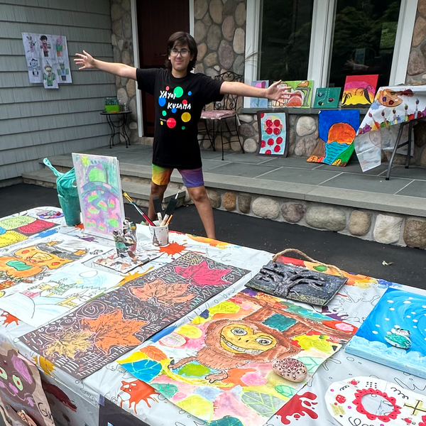 12-year-old Gus Goldstein at his at-home art gallery, a Mitzvah Project he used the profits from to get art materials into the hands of hospitalized children.