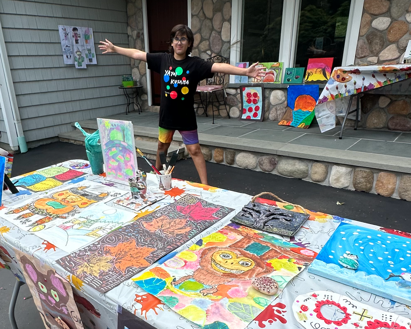 12-year-old Gus Goldstein at his at-home art gallery, a Mitzvah Project he used the profits from to get art materials into the hands of hospitalized children.