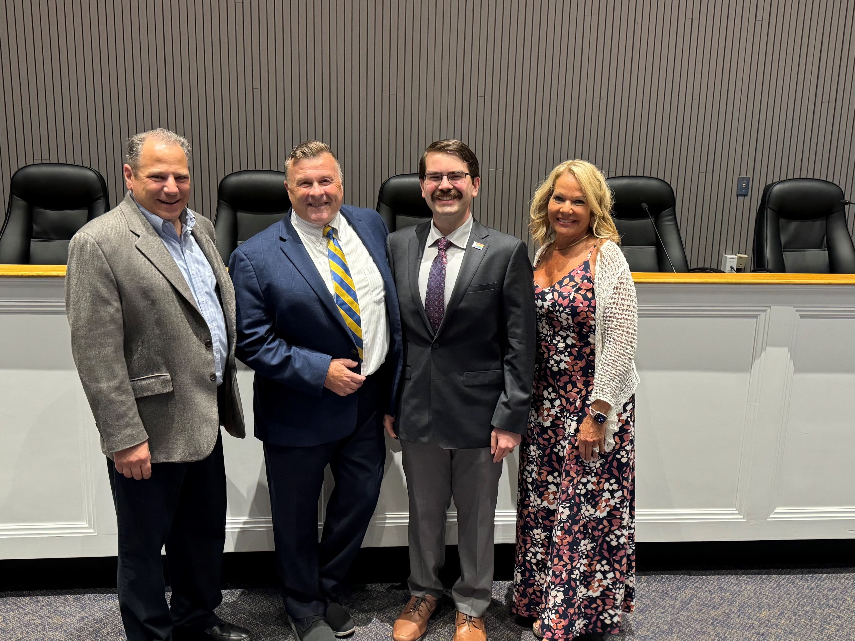 From left: Town of Huntington Clerk Andrew Raia, who swore in members of the town&#39;s first LBGTQ+ task force, Northport resident Joe Schramm and task force creator Phillip Griffin, along with TOH Councilwoman Theresa Mari. Photo credit Town of Huntington. 