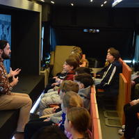 An educator with the Mobile Museum of Tolerance speaks with Northport Middle School students at a workshop dedicated to the story of Anne Frank. Photo courtesy Northport-East Northport Union Free School District. 