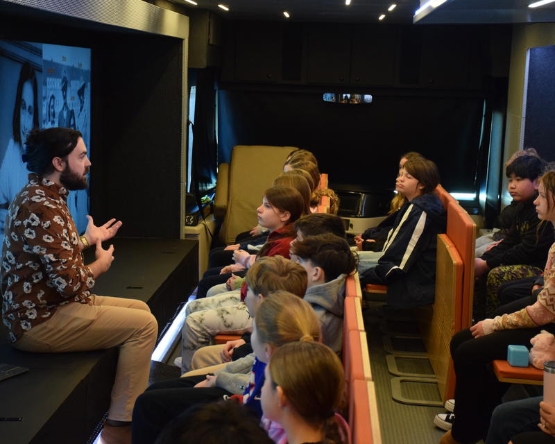 An educator with the Mobile Museum of Tolerance speaks with Northport Middle School students at a workshop dedicated to the story of Anne Frank. Photo courtesy Northport-East Northport Union Free School District. 