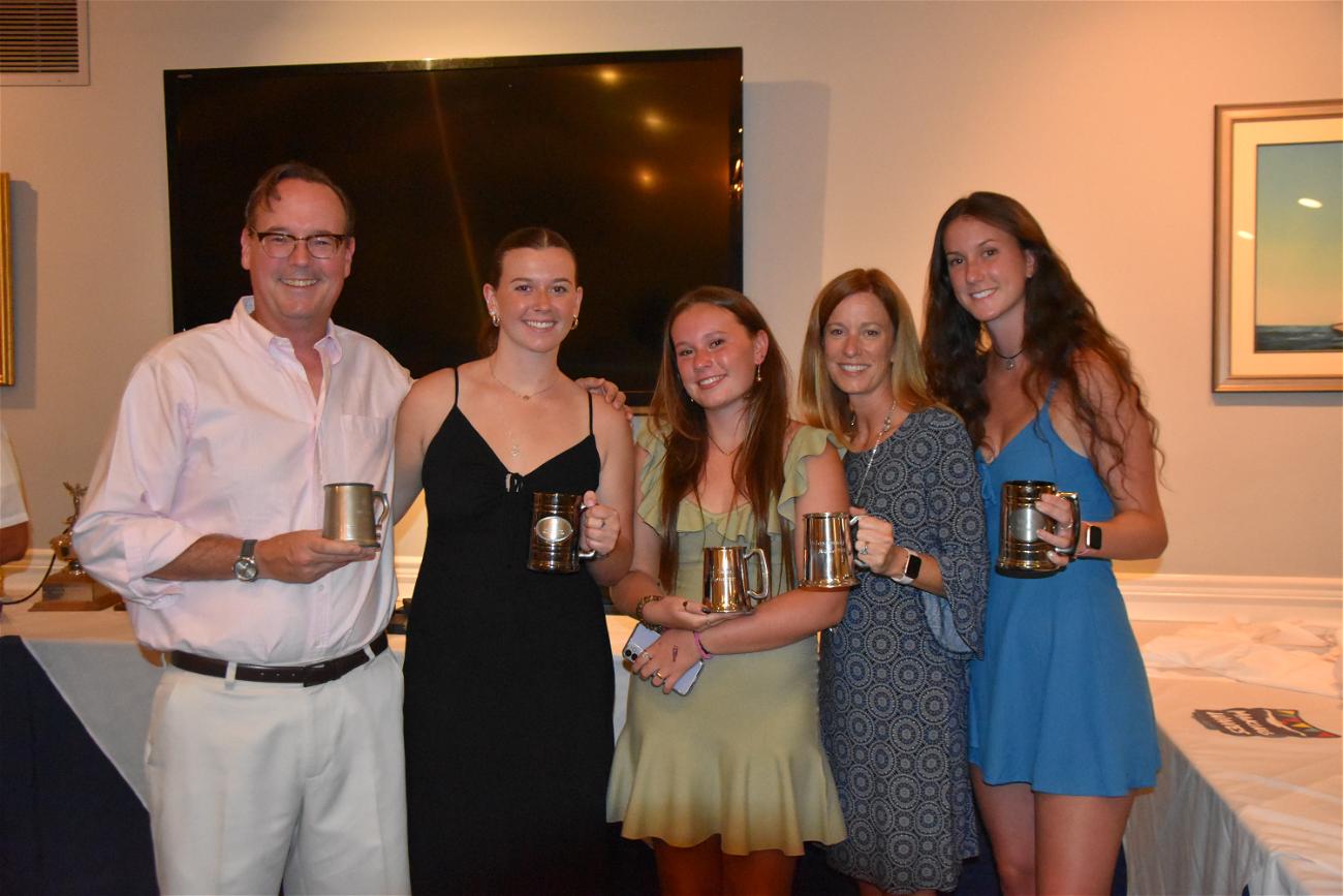 Northport Village resident Nora Nolan with her husband Mark and their three daughters at a Northport Yacht Club swim team awards dinner. 
