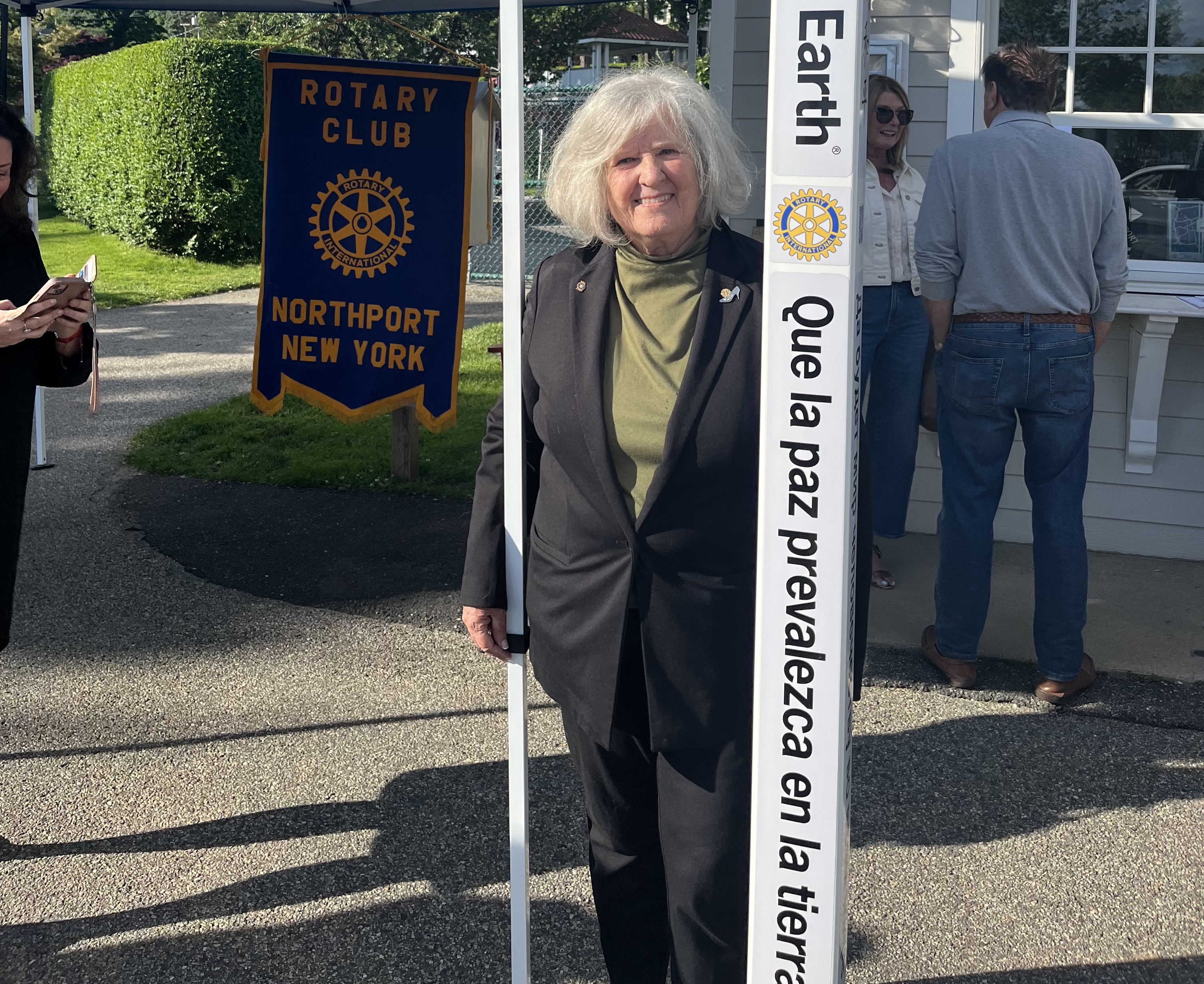Northport Rotary Club member Carolyn Kelly purchased the peace pole as a gift to the club; it was then donated to the Village of Northport.
