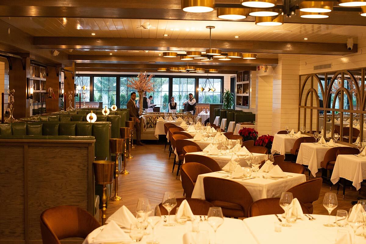 Andrew Affa of The Standard Hospitality Group walks the dining room right before opening hours at Arlo last week.