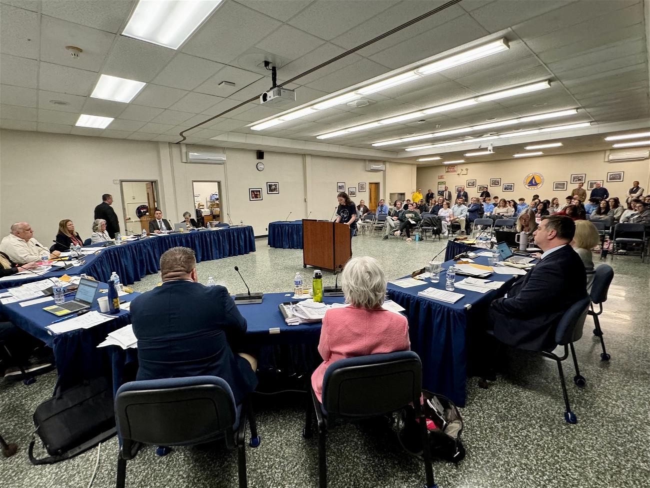 High school student Vivienne Cierski addresses the board of education at its April 4 meeting, during which possible reductions to the cost to run the school’s popular Students for 60,000 group were discussed. Photo courtesy Laura Brandies.