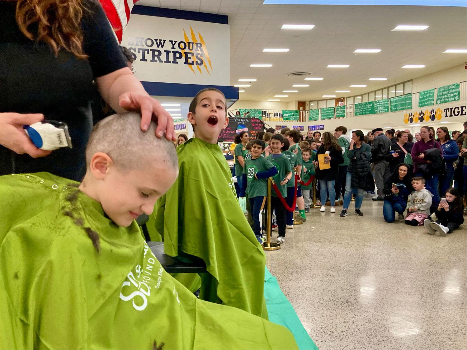 Members of the Fifth Avenue Fightin’ Irish at last week’s Brave the Shave event, which raised over $50,000 for pediatric cancer.