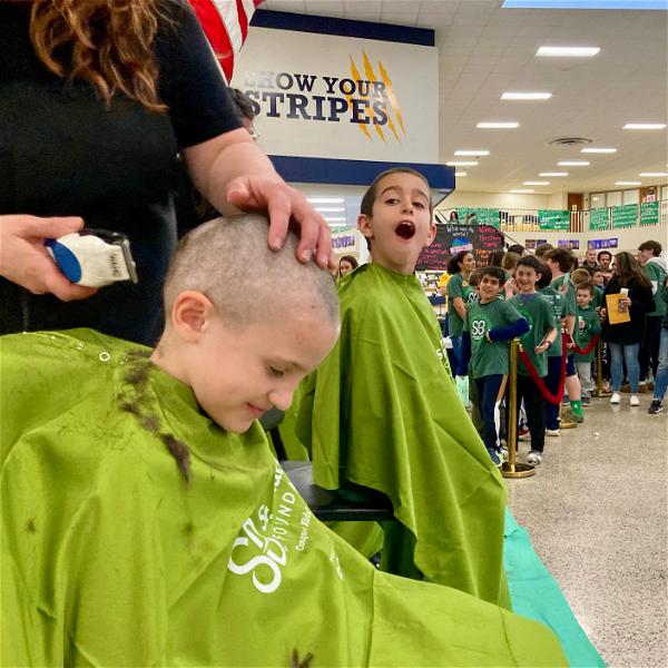 Members of the Fifth Avenue Fightin’ Irish at last week’s Brave the Shave event, which raised over $50,000 for pediatric cancer.