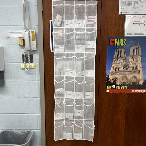 A renewed cell phone policy is back at Northport High School, with students required to deposit their cell phones into these clear multi-pocketed shoe organizers – or risk being marked absent. Photo by Vivienne Cierski. 