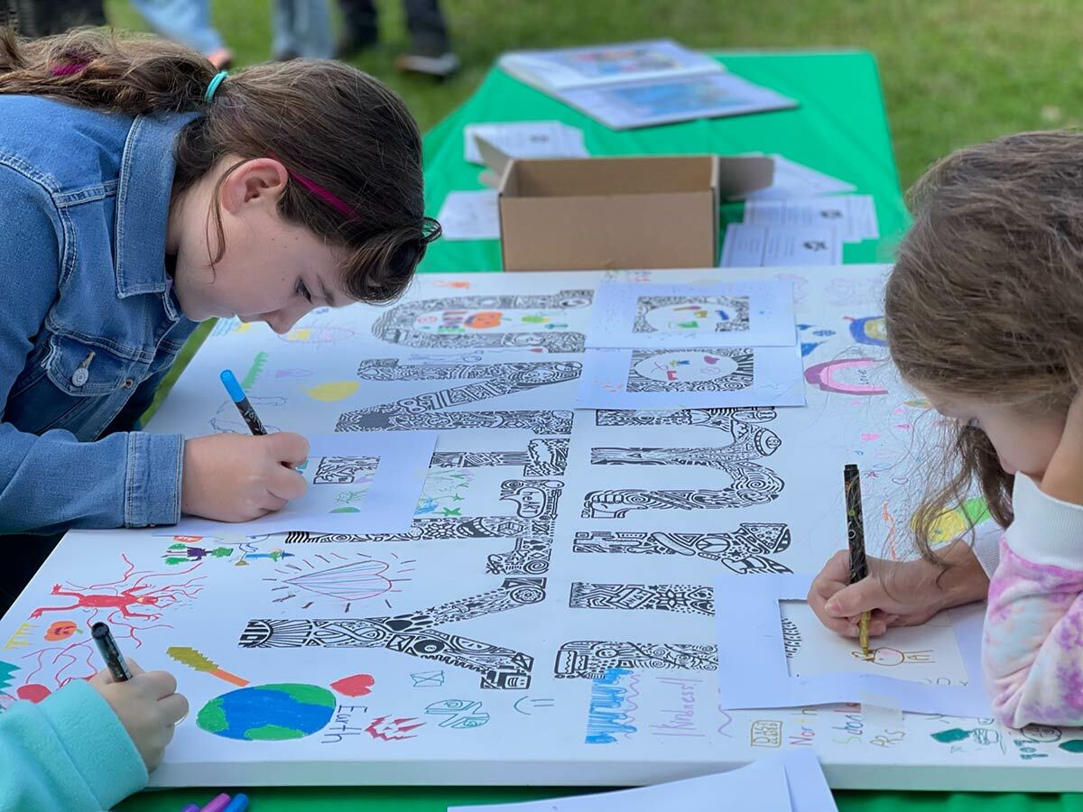 Children work on a project sponsored by Ink'd Art Studio at the third annual NIOT in the Park event this past weekend.