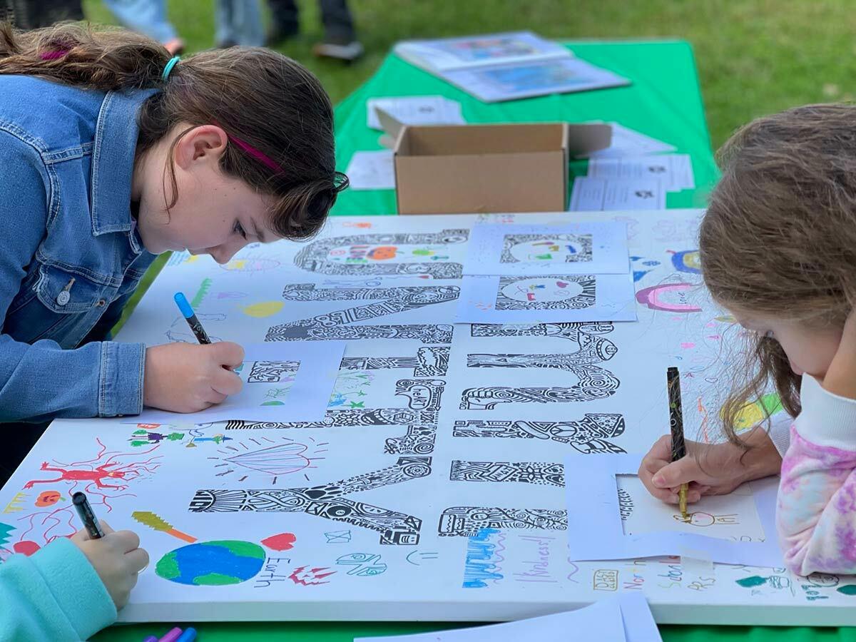 Children work on a project sponsored by Ink&#39;d Art Studio at the third annual NIOT in the Park event this past weekend.