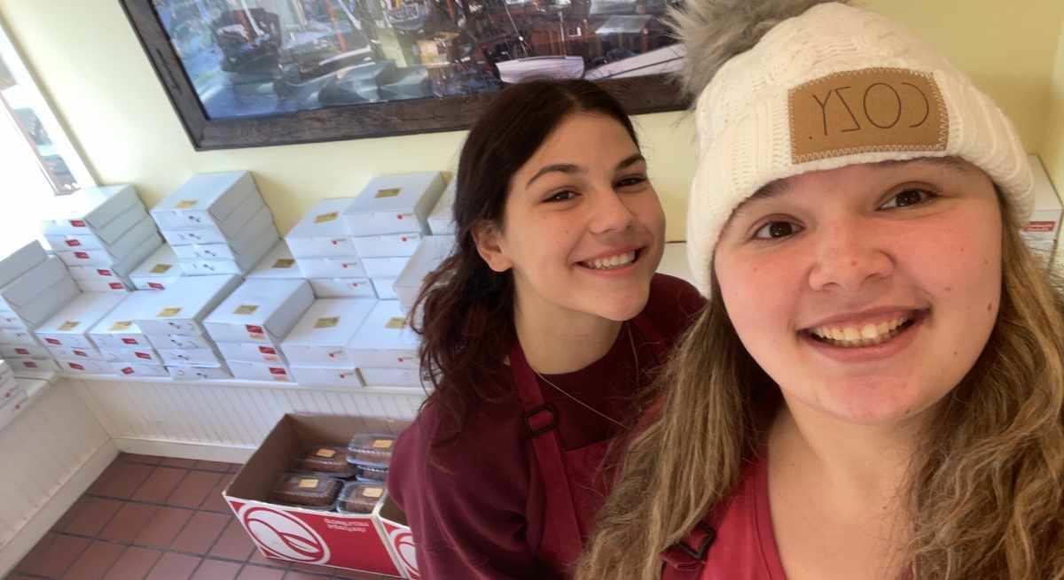 Jessica Greenbaum (right) and Olivia Kurtz worked hard to prepare pies on pickup day for the annual pie fundraiser at Copenhagen Bakery &amp; Cafe.