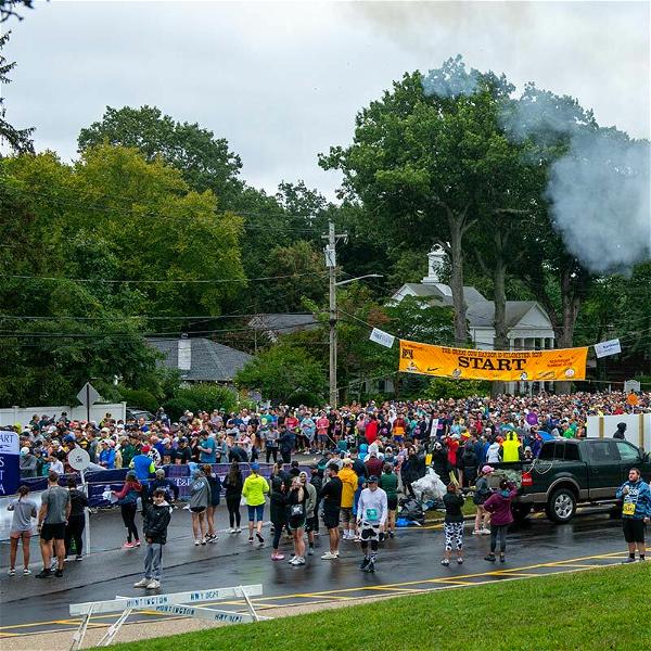 A view from the Great Cow Harbor 10K starting line yesterday, September 23. Approximately 3,560 of the 5,000 registered participants took to the streets of Northport despite forecasts of heavy rain and wind.