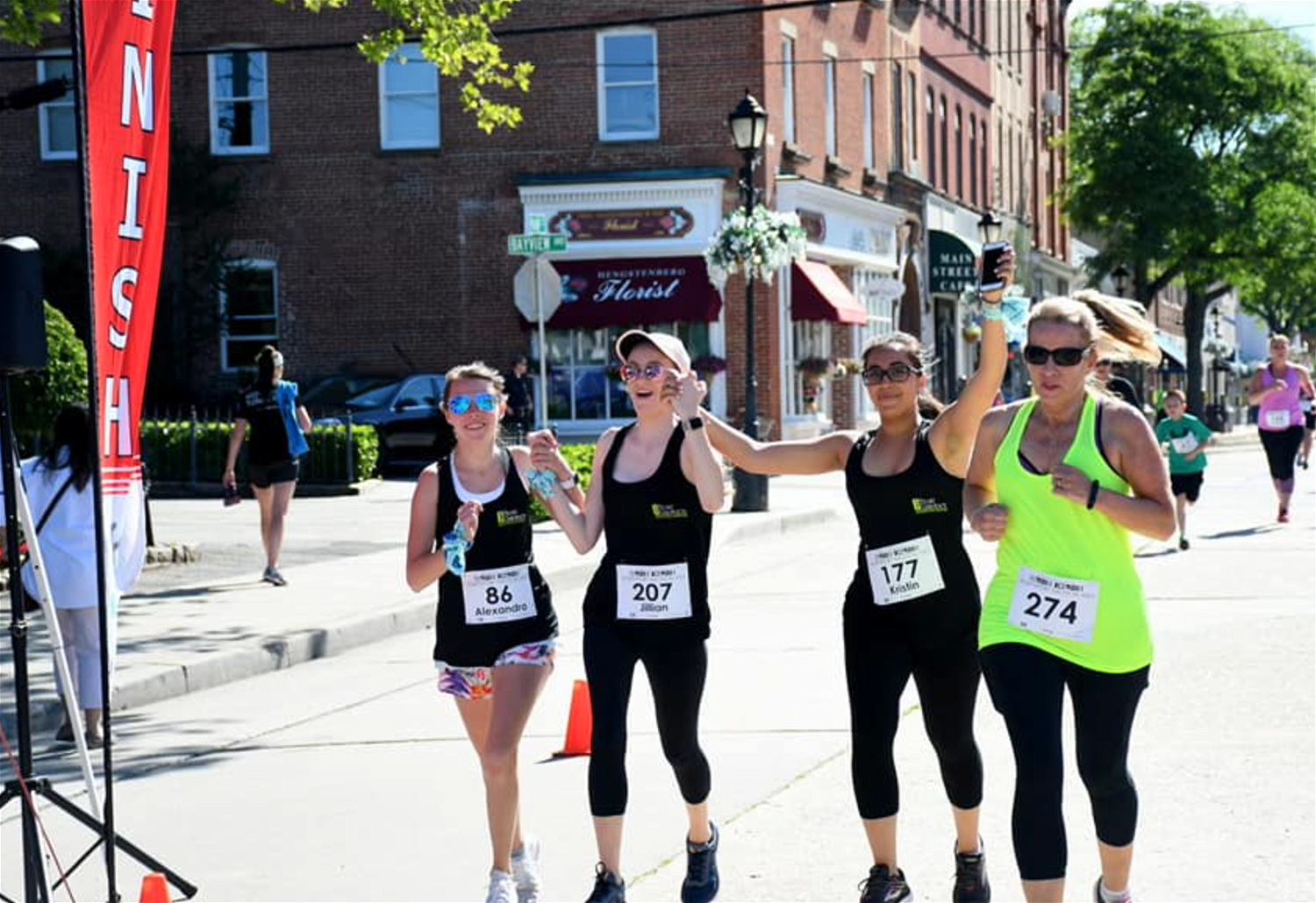 Runners at a past Downhill/Nautical Mile approach the waterfront finish. Photo via Facebook.