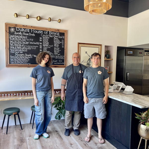 Duke’s House of Bowls owner Gene DeFreitas (center) announced the opening of his Woodbine Avenue eatery last week and is already gaining popularity for unique takeout options in Northport Village. 