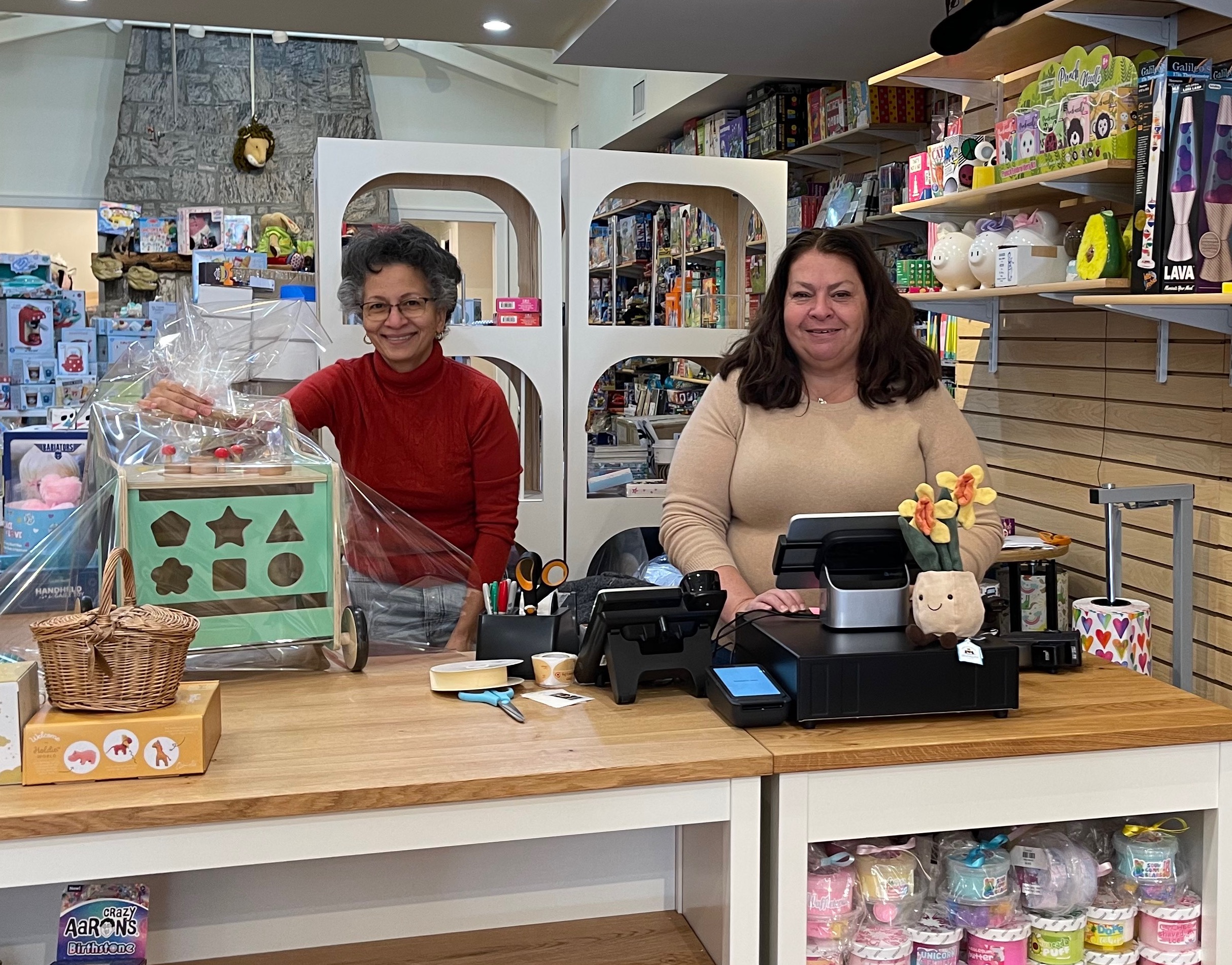 Toy store owner Lori Badanes at the register of the newly opened Einstein’s Attic Huntington. 