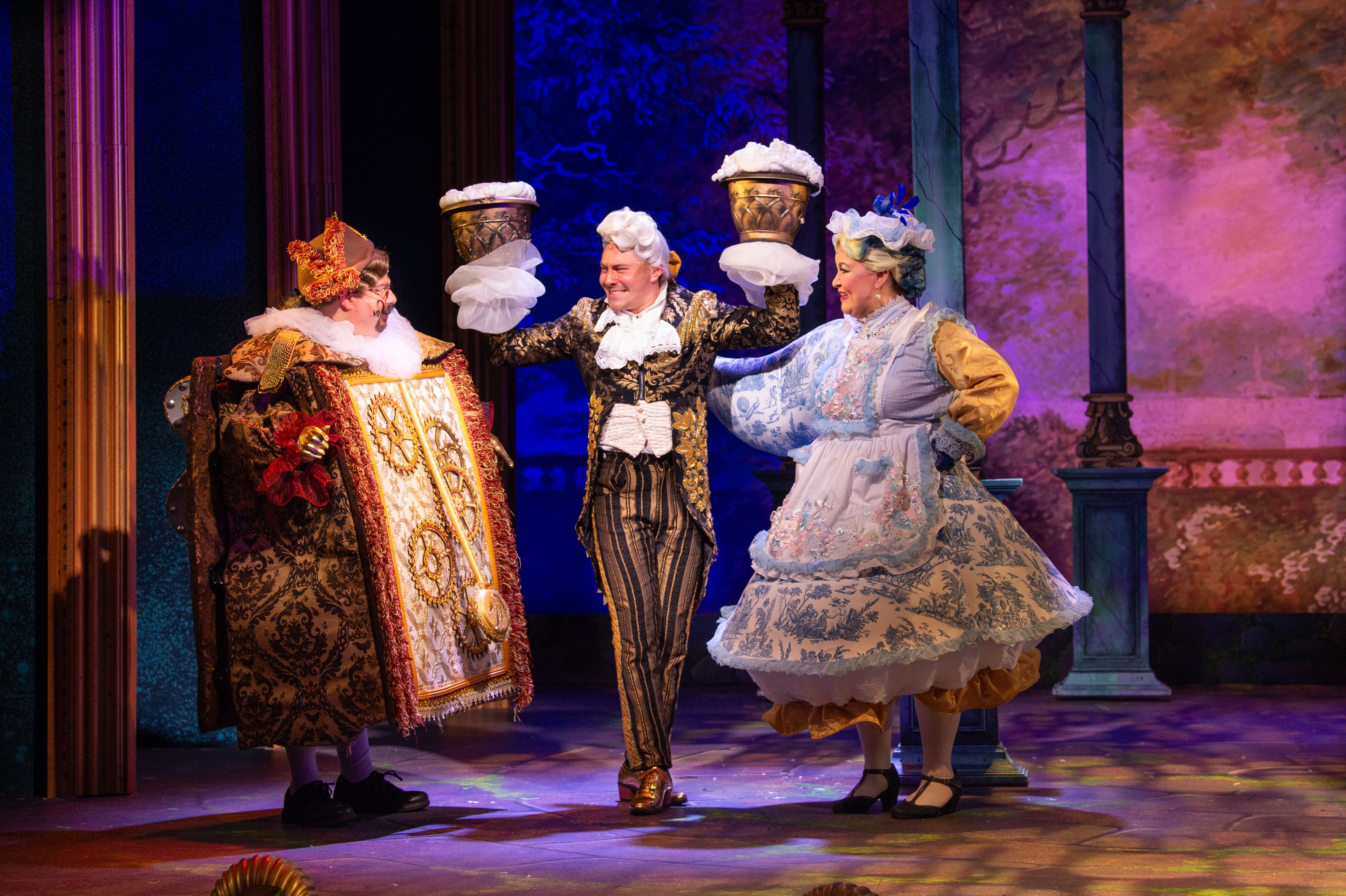 Beauty and the Beast runs until December 31 at the John W. Engeman Theater. From left: Robert Anthony Jones (Cogsworth), Jonathan Cobrda (Lumiere) and Caitlin Burke (Mrs. Potts). Photo courtesy of the Engeman Theater.