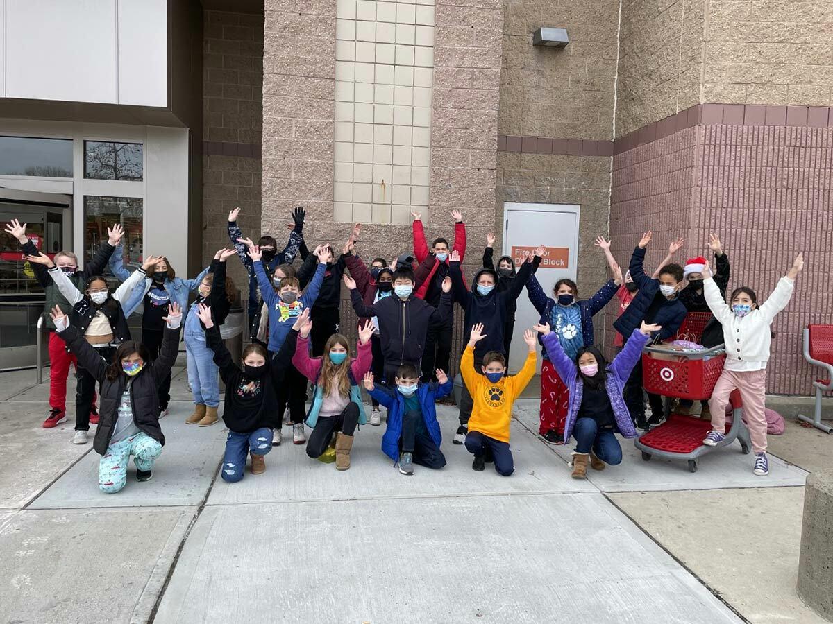 Fifth Avenue Elementary School students celebrated a successful trip to purchase gifts for families in need. Photo courtesy of the Northport-East Northport Union Free School District.