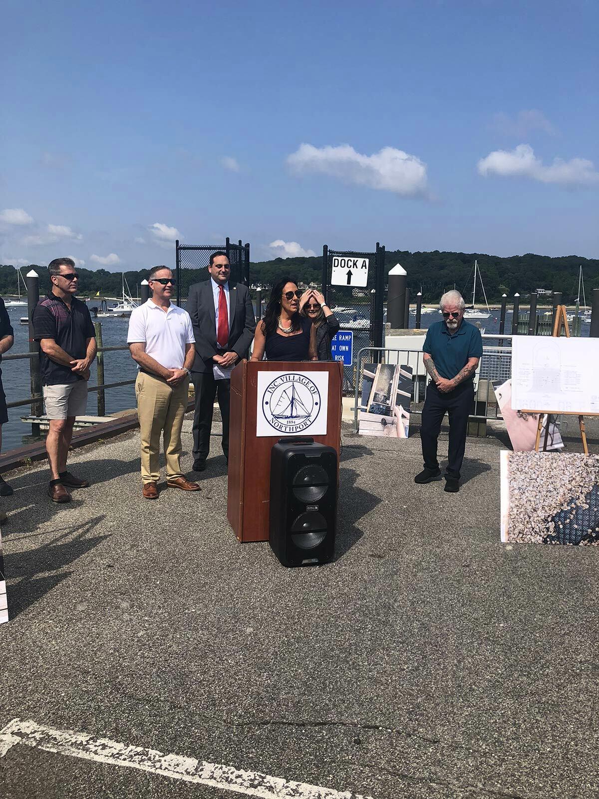 Former Northport Village Trustee Mercy Smith (at podium) spearheaded the FLUPSY program, beginning the initiative in 2018 as head of the 125th Anniversary Committee.