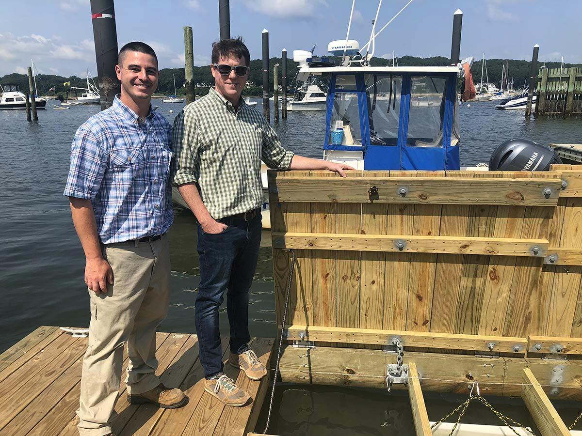 Barry Udelson (left) from Cornell Cooperative Extension and Northport resident Sean Tamaro, the site supervisor, will be working together to maintain the FLUPSY floats at the Woodbine Marina.