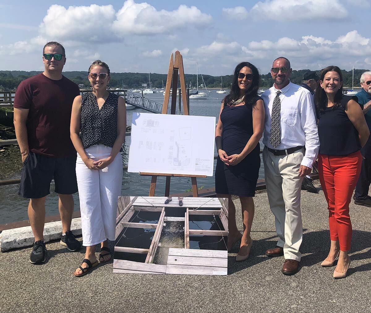 Northport Village Trustee Dave Weber, who will be leading the program, stands with Mercy Smith and founders of the Northport Native Garden Initiative (from left: Matt Gorman, Sara Abbass and Nicole Tamaro), who will be matching donations up to $500 made to help fund the FLUPSY program.