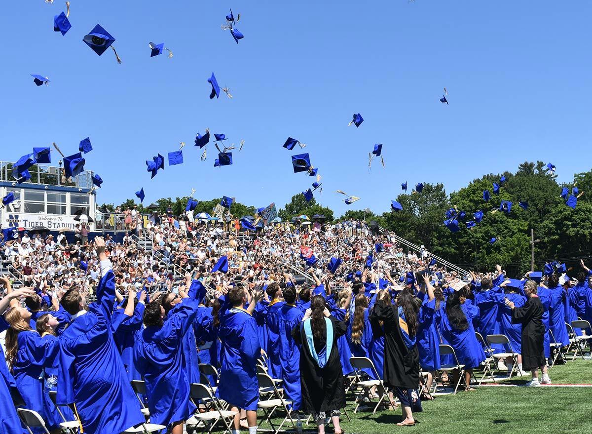 The Northport High School class of 2022 tosses their caps in celebration. Photo courtesy of the NENUFSD.