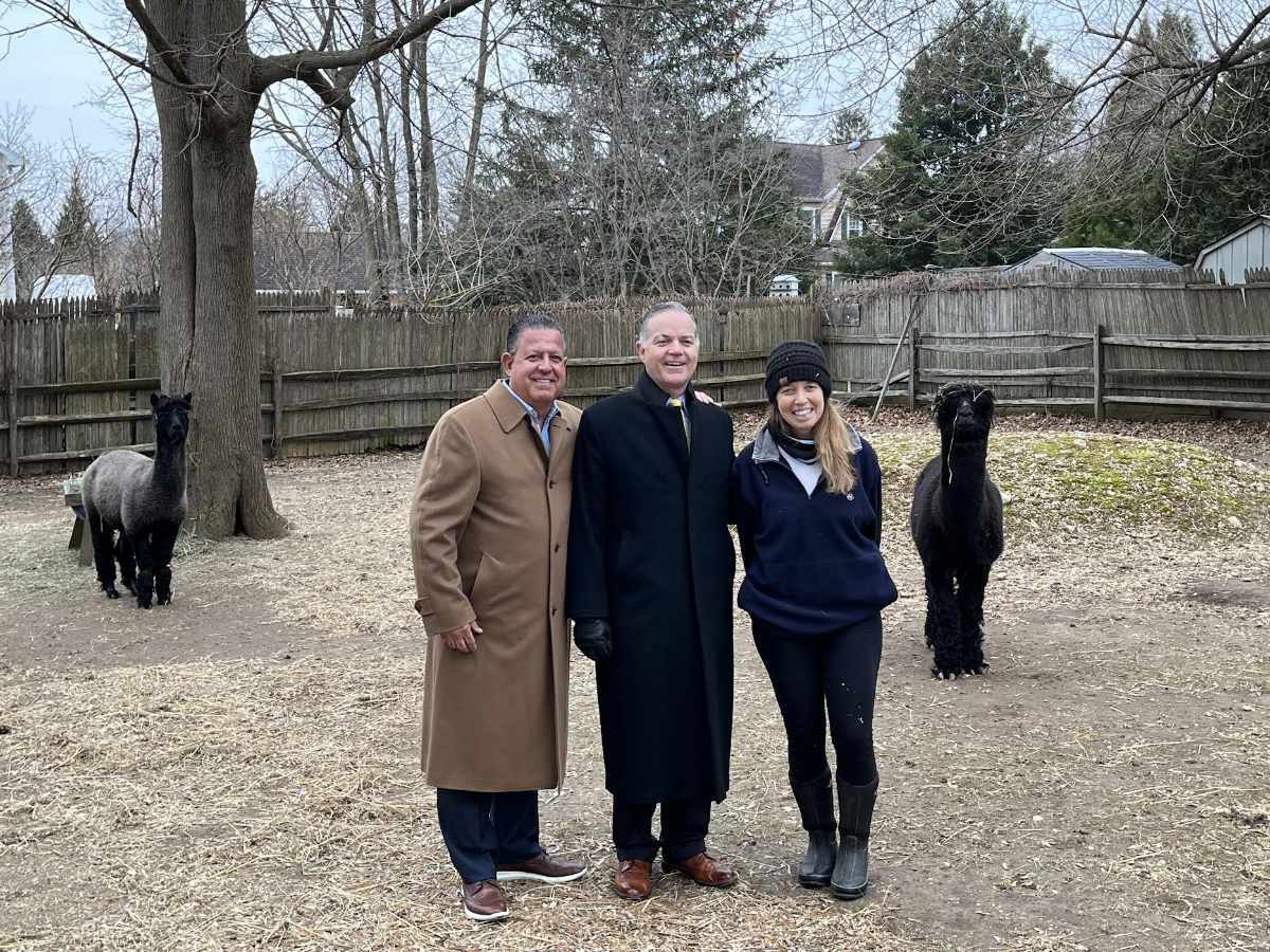 Huntington Town Councilman Salvatore Ferro, Supervisor Ed Smyth and barn manager Lorena Ericksen at Lewis Oliver Farm in Northport Village. Photo courtesy the Town of Huntington.