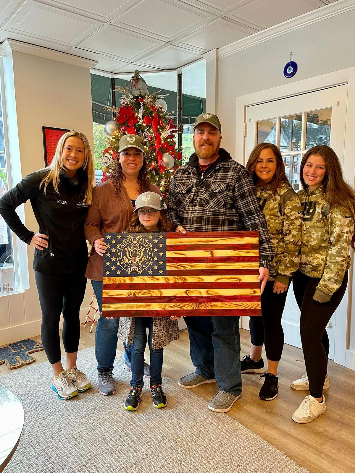 JK Consulting partners and brand director with Veteran Robert Engel and his family. (Pictured from left to right: Kelley Henneberry, Katelin, Penelope and Robert Engel, Jennifer Pinto, and Diana Girimonti.) Photo courtesy JK Consulting.