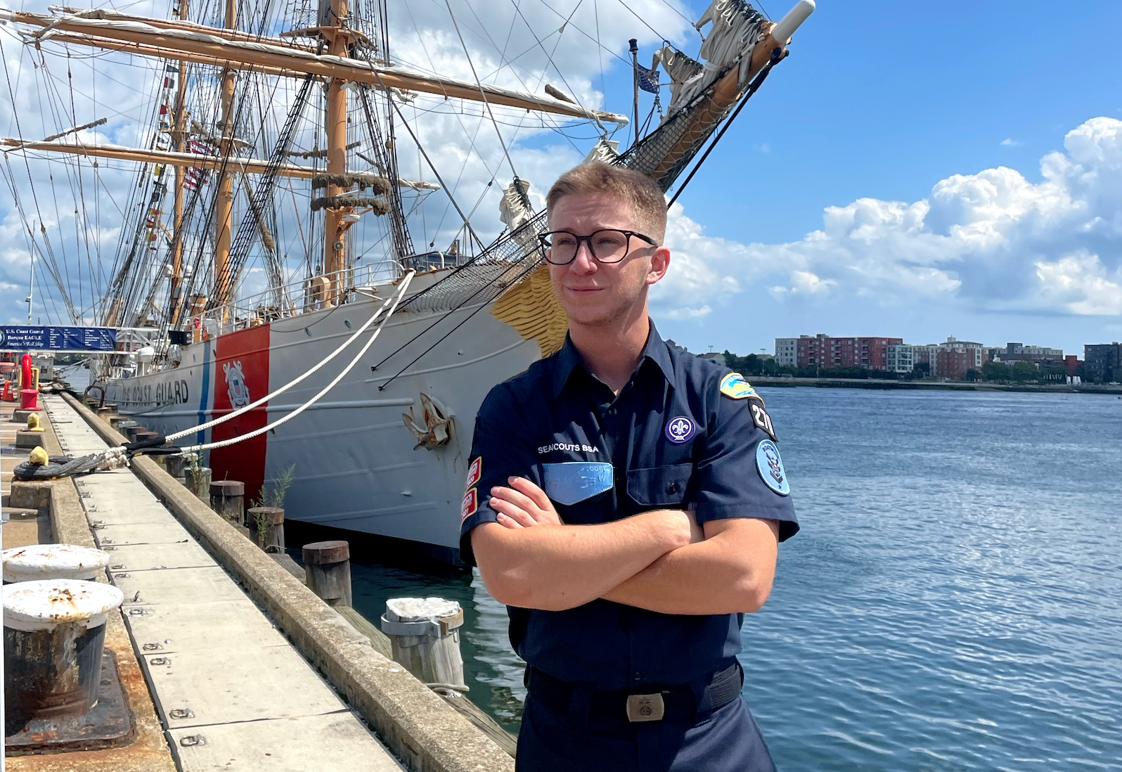 East Northport resident and Northport High School graduate Jonas Raio outside the Coast Guard Cutter Eagle. Raio, an outgoing boatswain for Sea Scout Ship 270, spent a week aboard the vessel. Photo courtesy Sea Scout Ship 270. 