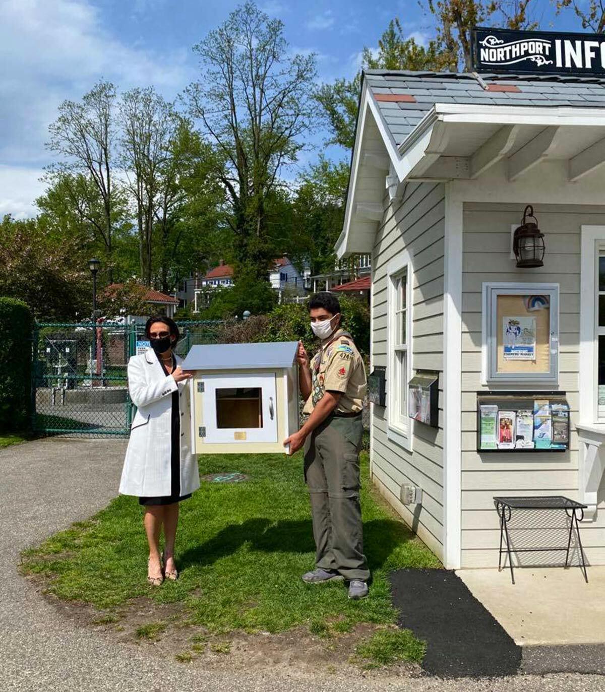 Michael Monda with Village Trustee Mercy Smith at the presentation of the lending library in Northport Village Park. Photo courtesy of Maria Monda.