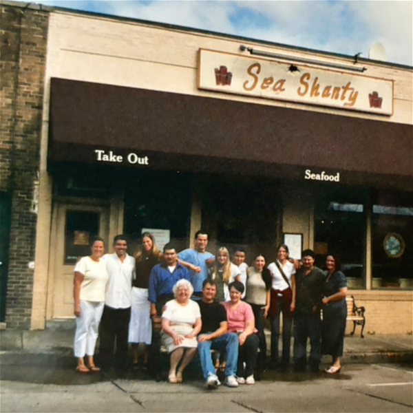 Restaurant owner Marie José Blazej (seated, left) and staff in front of the Sea Shanty on Woodbine Avenue in Northport Village. Blazej passed away last month, on March 21. Photo via the Gately Funeral Home website. 