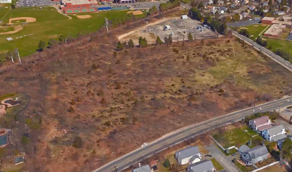 An aerial view of the corner of Pulaski and Elwood Road, slated for development as Matinecock Court.