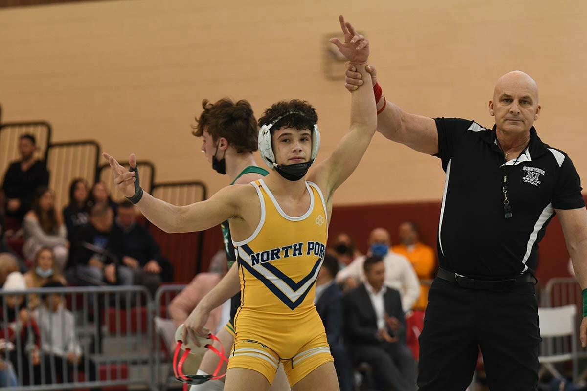 Northport High School sophomore Matthew Marlow on the mat after winning the champion title. Photo courtesy of the Northport-East Northport Union Free School District.