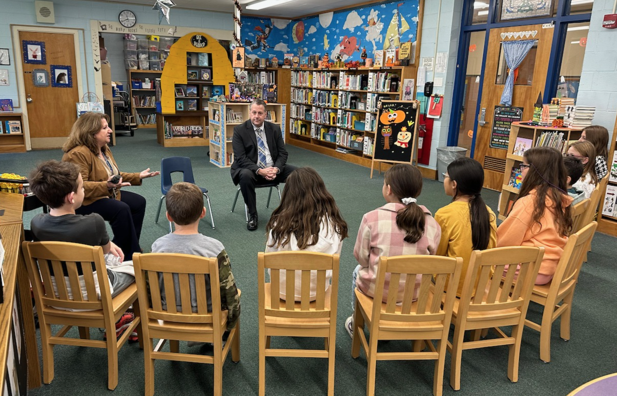 Dr. Dave Moyer on a tour of the Northport-East Northport school district last Friday, October 13. He is pictured here with Principal Lori Beekman and Pulaski Road Elementary School students. Photo courtesy of the NENUFSD Facebook page. 