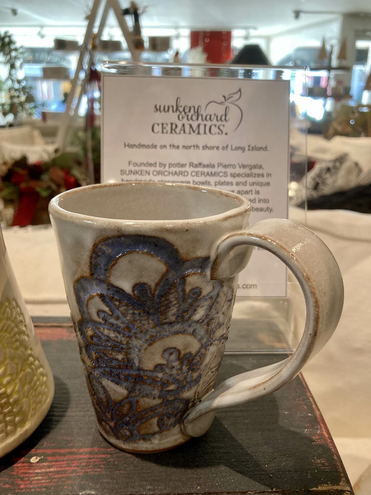 Various items from Sunken Orchard Ceramics are on display throughout the store.