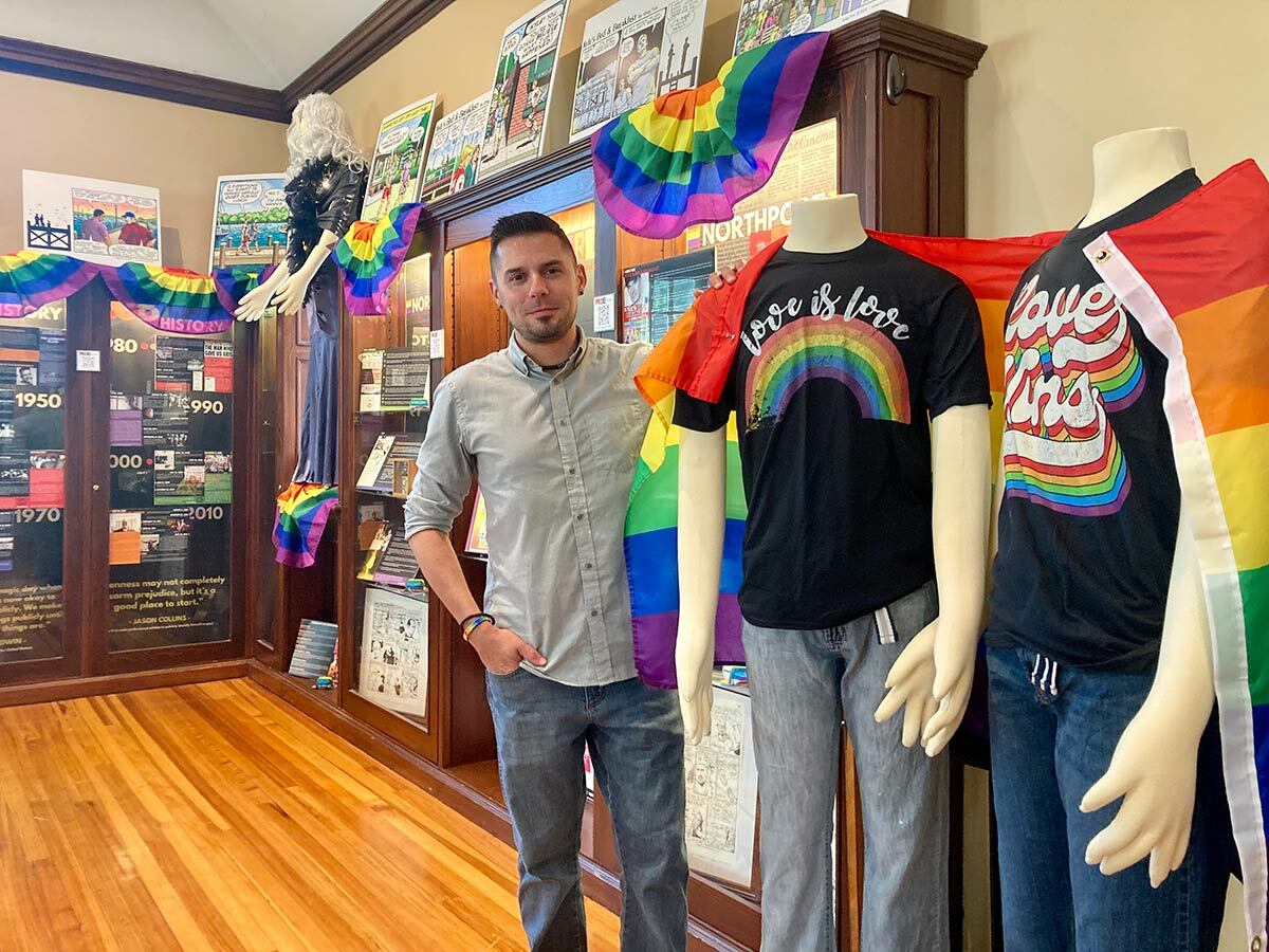 Northport Historical Society Marketing and Membership Coordinator John Daniello at PRIDE!, the society’s first LGBTQ exhibit.