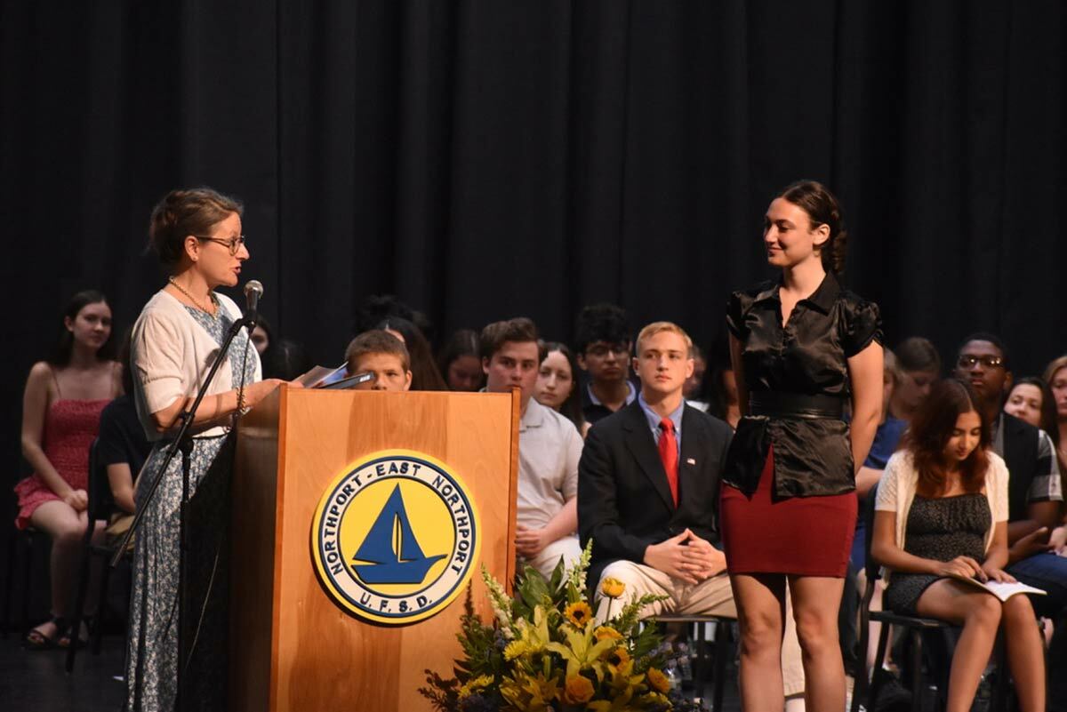 IB Coordinator and teacher Anna Kessler presents the David Trachtenberg Memorial Scholarship award to senior Jennifer Weigand. Photo courtesy of the Northport-East Northport school district.