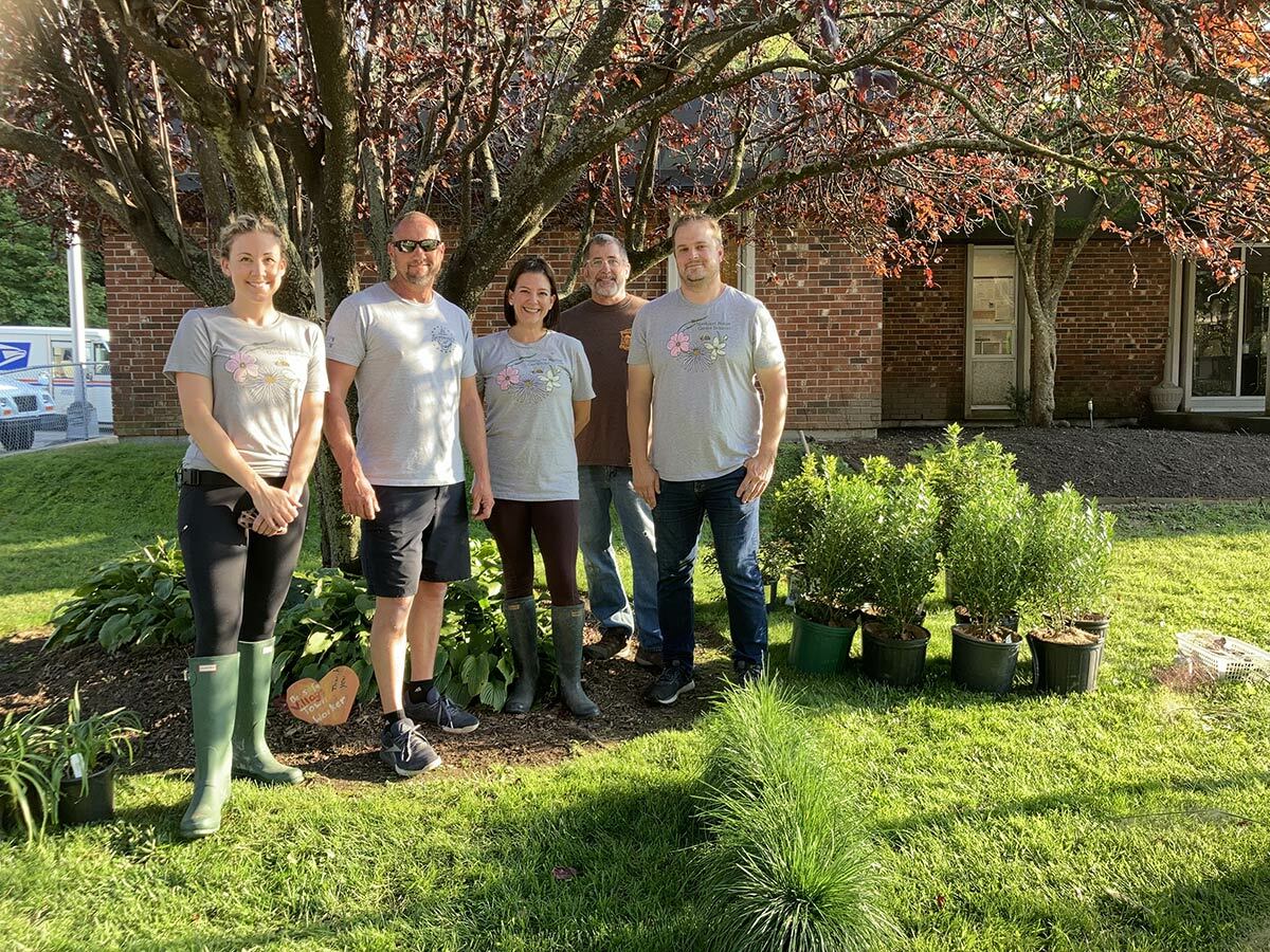 NNGI founders Sara Abbass (left), Nicole Tamaro (center) and Matthew Gorman (right) with Northport Village Trustee Dave Weber and NNGI volunteer Eric Sandin before installing over 150 plants at Northport Village Hall.