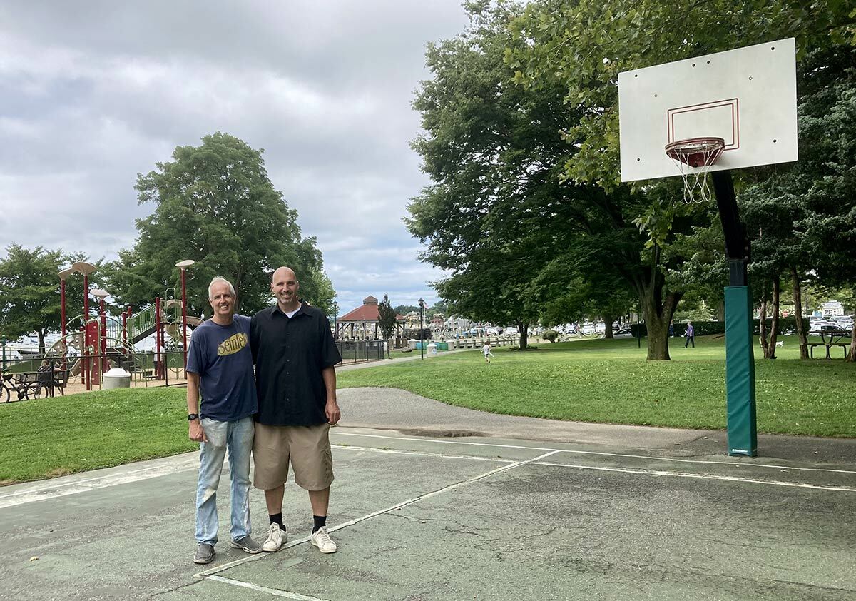 Captain of the Northport High School 1995 Long Island Champion Boys Basketball team, Doug Trani is helping to spearhead a group effort to renovate the basketball court in Northport Village’s Cow Harbor Park. The new court will be dedicated to lifetime Northport resident and youth basketball coach and mentor, John Kennedy (pictured here with Doug).