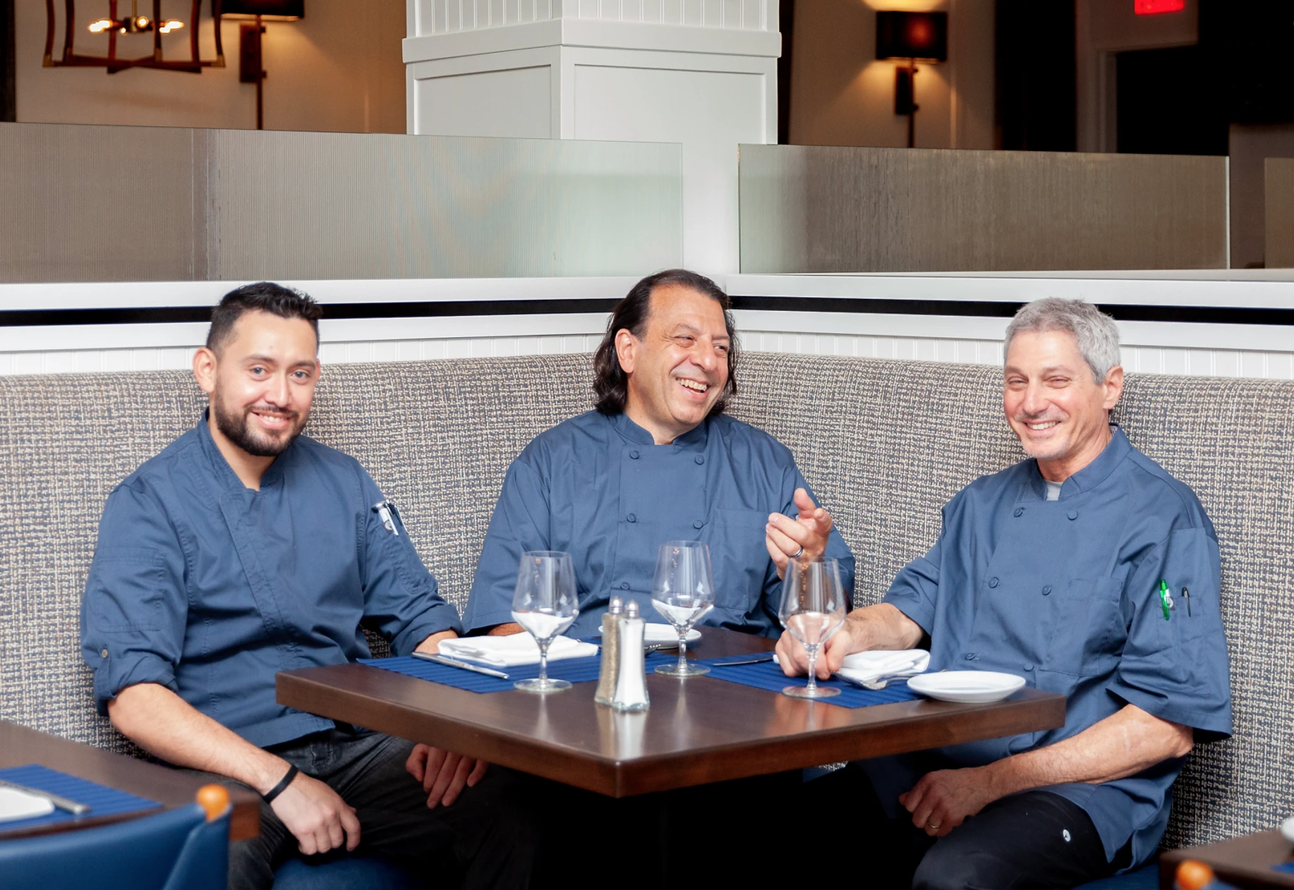 From left to right, Chef Juan Jimenez, Executive Chef Michael Ross, and Chef David Glatzerman at The Restaurant at The Northport Hotel. Photo via The Northport Hotel website. 