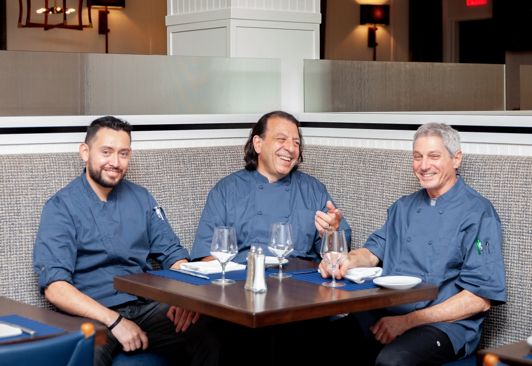 From left to right, Chef Juan Jimenez, Executive Chef Michael Ross, and Chef David Glatzerman at The Restaurant at The Northport Hotel. Photo via The Northport Hotel website.