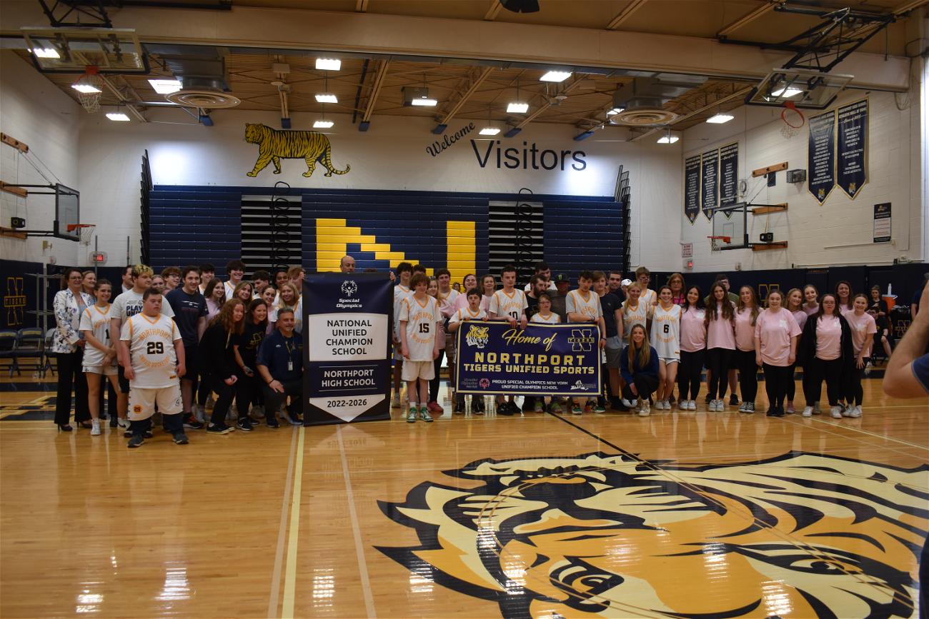 Northport High School administrators and faculty alongside members of the Unified basketball team and Sparkle Squad dance team. Photo courtesy of Northport-East Northport Union Free School District.