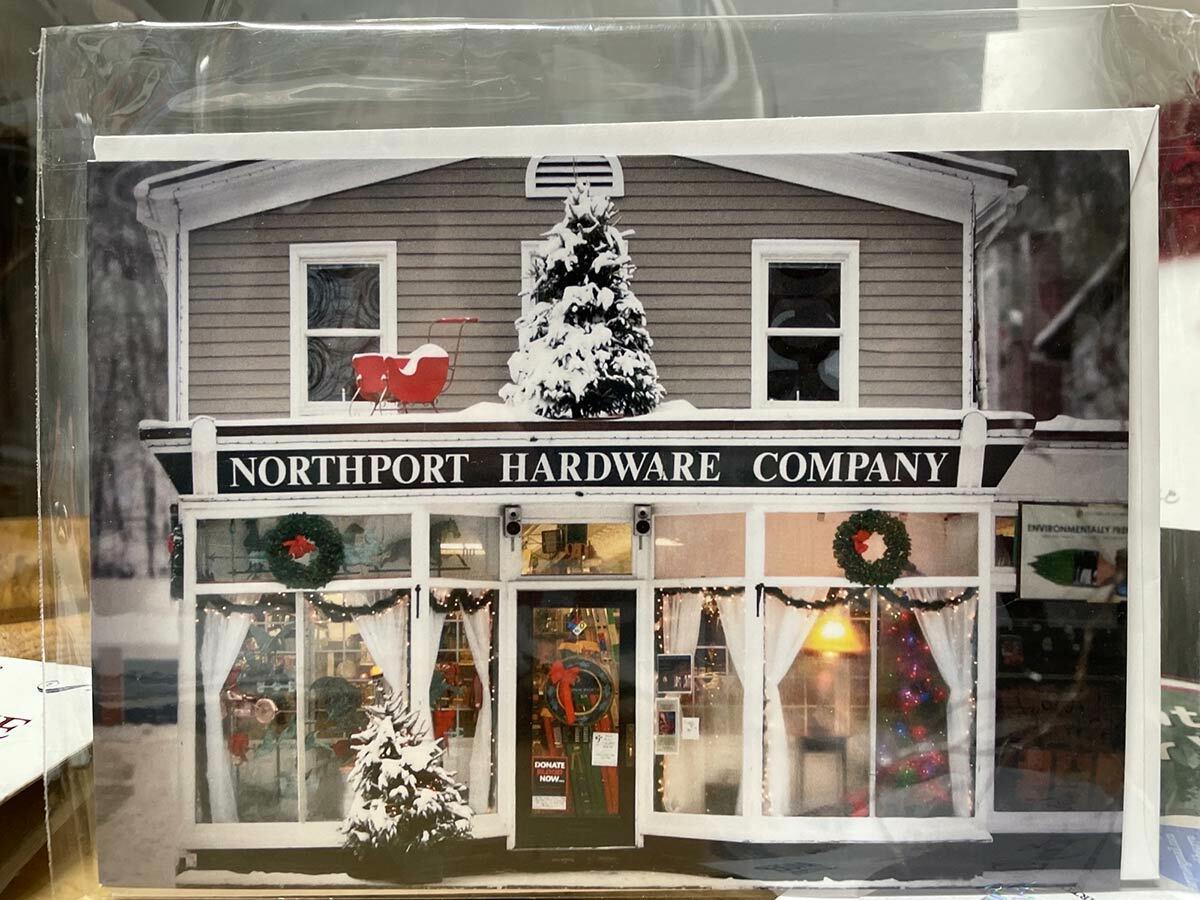 A photo of Jen Lau’s holiday card, featuring the Northport Hardware Company — and its leg lamp. Image via Katheryn Laible/The Firefly Artists.