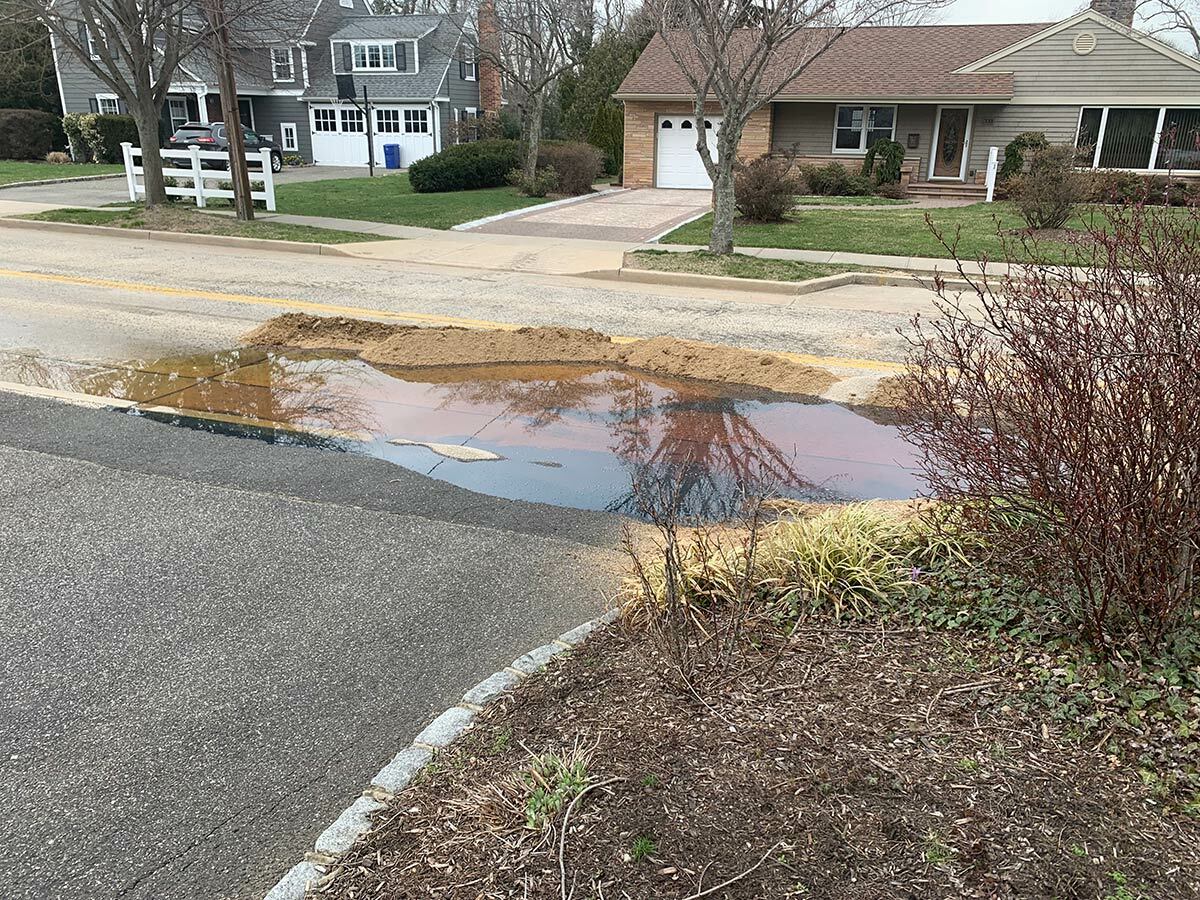 A portion of the dielectric cable fluid spill, in front of a Scudder Avenue homeowner’s driveway on March 30.